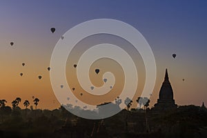 Sunrise many hot air balloon in Bagan, Myanmar. Bagan is an ancient with many pagoda of historic buddhist temples and stupas.