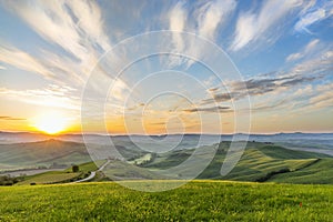 Sunrise on a meadow in a rural Italian landscape