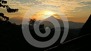 Sunrise between Merbabu and Mount Merapi