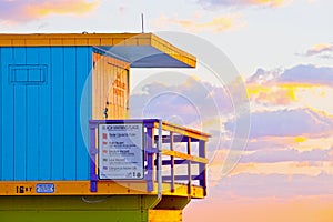 Sunrise in Miami Beach Florida, closeup with a colorful lifeguard house