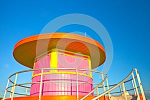 Sunrise in Miami Beach Florida, closeup with a colorful lifeguard house