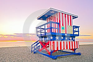 Sunrise in Miami Beach Florida, with a colorful American Flag lifeguard house