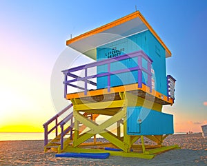 Sunrise in Miami Beach Florida, with a colorful lifeguard house