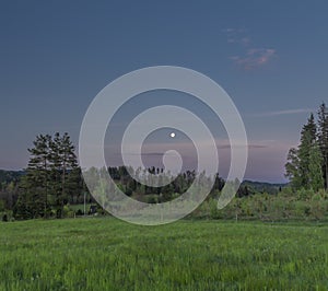 Before sunrise with moon and pasture land near Valasska Polanka village