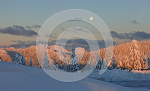 Sunrise with moonset in the west