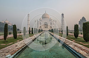Sunrise and morning fog at the Taj Mahal in Agra - India
