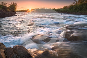 Sunrise on a mountain river Prut