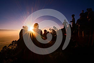 Sunrise at mountain with silhouette people and couple success to