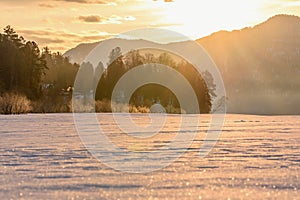 Sunrise mountains winter sun rays trees