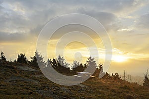 The Sunrise in the mountains and wooden table