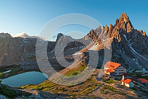 Sunrise in the National Park Tre Cime di Lavaredo with rifugio Locatelli and lake, Dolomiti Alps, South Tyrol, Italy