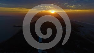 Sunrise near a Lighthouse as seen by a Drone in 4K