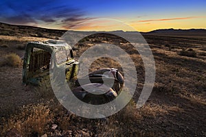 Sunrise over abandoned truck, Nevada desert