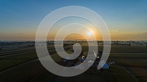 Sunrise Over an Amish Farm with Blues and Reds on a Clear Summer Morning