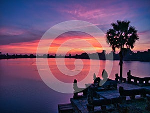 Sunrise over the ancient bathing pool of Sras Srang, part of the Angkor Archaeological Park near Siem Reap in Cambodia