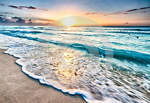 Sunrise over beach in Cancun photo