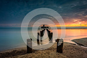 Sunrise over the beach and torpedo platform at Baltic Sea in Babie Doly, Gdynia. Poland