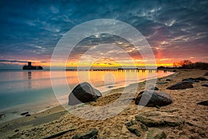 Sunrise over the beach and torpedo platform at Baltic Sea in Babie Doly, Gdynia. Poland