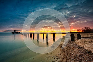 Sunrise over the beach and torpedo platform at Baltic Sea in Babie Doly, Gdynia. Poland