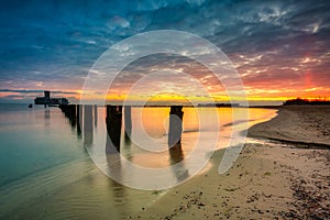 Sunrise over the beach and torpedo platform at Baltic Sea in Babie Doly, Gdynia. Poland