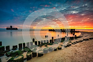 Sunrise over the beach and torpedo platform at Baltic Sea in Babie Doly, Gdynia. Poland