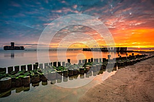 Sunrise over the beach and torpedo platform at Baltic Sea in Babie Doly, Gdynia. Poland