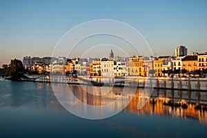 Sunrise over the beautiful district of triana on guadalquivir