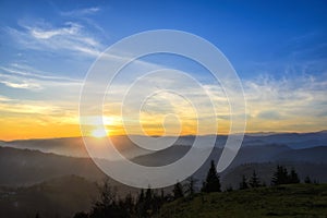 Sunrise over black forest mist