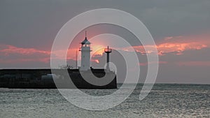 Sunrise over the Black Sea against a beacon in Yalta