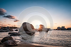 Sunrise over boulders at Cavallo Island in Corsica