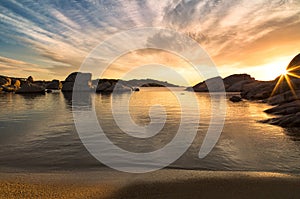 Sunrise over boulders on Cavallo Island south of Corsica