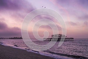 Sunrise over Brighton piers