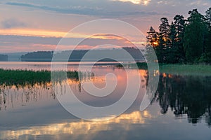 Sunrise over a calm lake in Filipstad Sweden