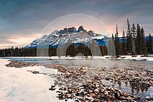 Sunrise over Castle Mountain over bow river in winter at Banff national park