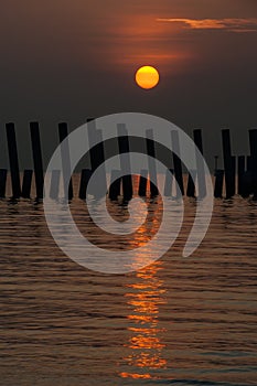 Sunrise over the construction piling