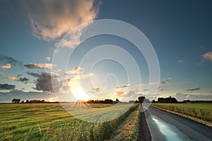 Sunrise over countryside road