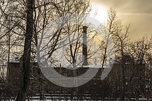 Sunrise over the factory chimneys