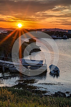 Sunrise over fishing stages on change Islands