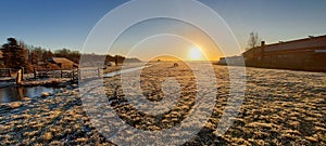 Sunrise over the frozen meadows on Park Hitland photo