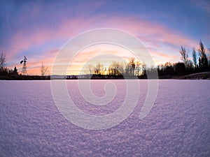 Sunrise Over Frozen Pond