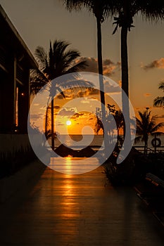 Sunrise over the Gulf of Mexico reflected into the boarkwalk at the resort