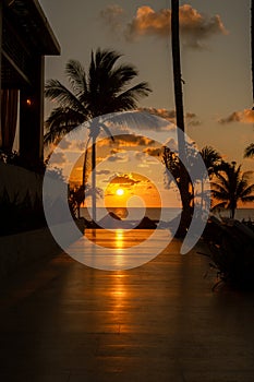 Sunrise over the Gulf of Mexico reflected into the boarkwalk at the resort