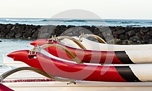 Sunrise over hawaiian canoes from Waikiki Hawaii