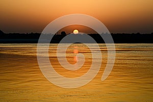 Sunrise over the Holy River Ganges photo