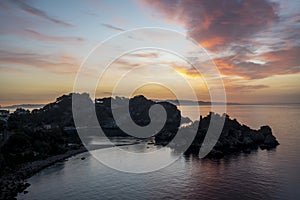 Sunrise over Isola Bella island near Taormina, Sicily, Italy