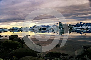 Sunrise over Jokulsarlon glacier lagoon filled with icebergs, Iceland