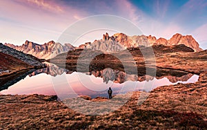 Sunrise over Lac Long with Massif des cerces reflection on the lake in Claree valley at French Alps, France