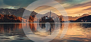 Sunrise over Lake Bled with St. Marys Church of the Assumption on the small i