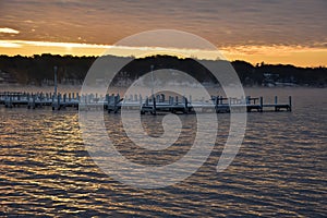 Sunrise Over a Lake with Docks in the Mist Rising Above the Water