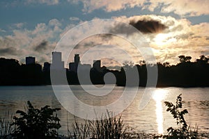 Sunrise over Lake of the Isles with Minneapolis Skyline in Silhouette